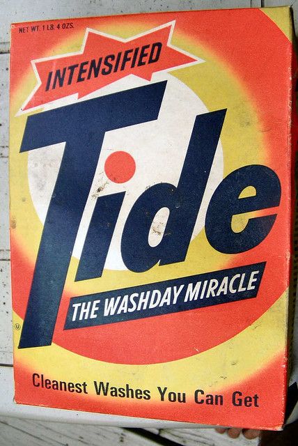 The familiar old tide box with a bullseye in orange and yellow and Tide in a slanted san-serif blue font.